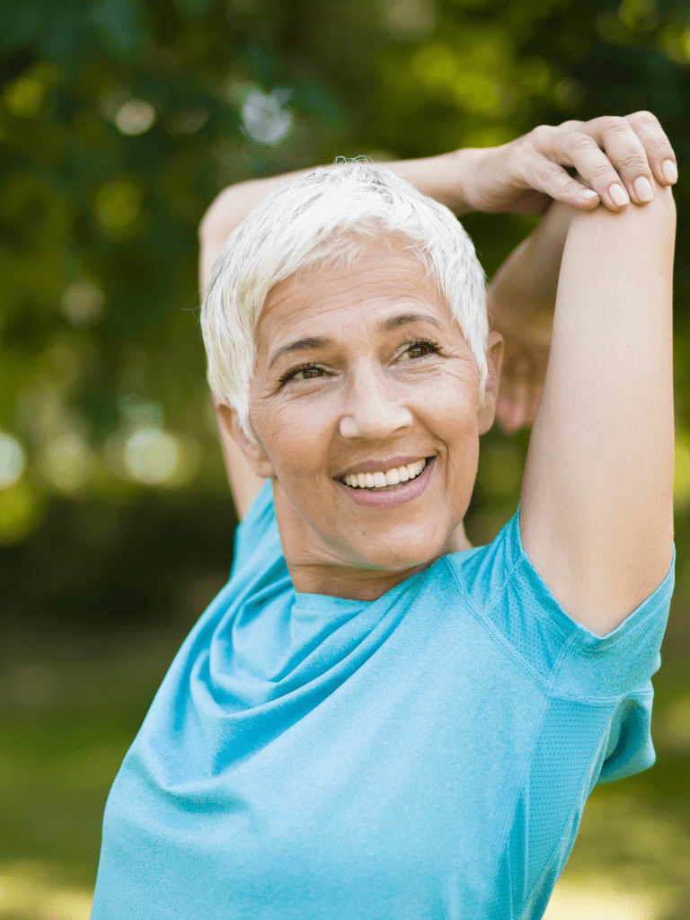 Woman practicing a gentle stretching and range of motion exercise. 